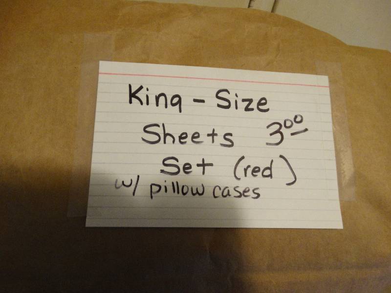 lot 435 image: Box of Queen size sheets & red king size satin.