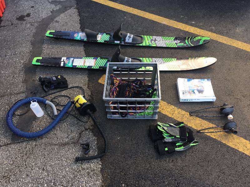 lot 21 image: MISC BOATING SKIES BOOK GLOVES TOW ROPE AND MORE
