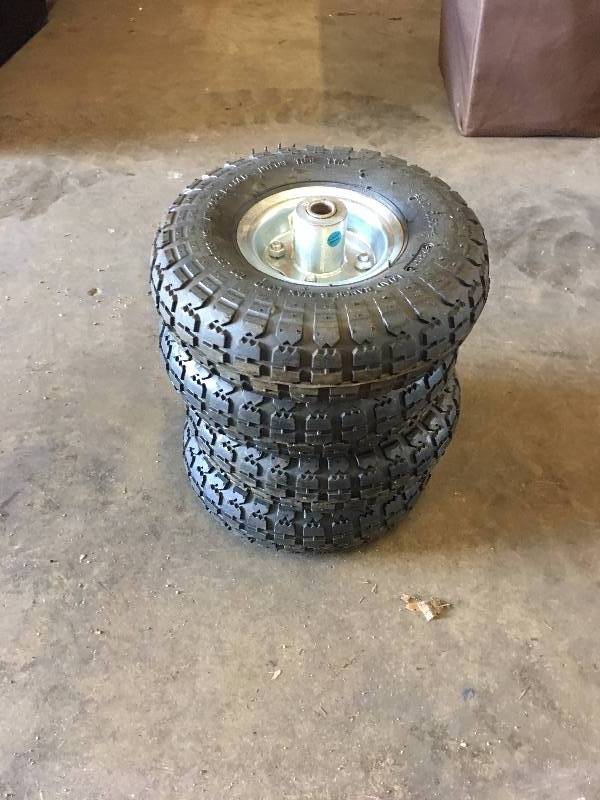 lot 47 image: LOT OF 4 DOLLY WHEELS AND TIRES