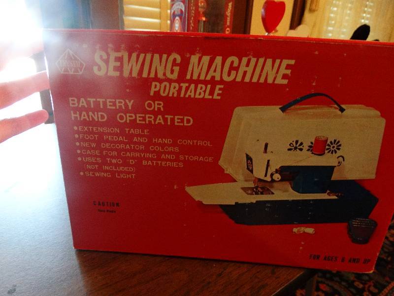 lot 101 image: Mini Crystal sewing machine.