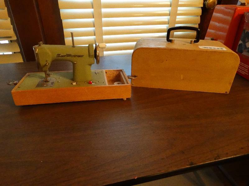 lot 117 image: Mini Vintage Salesman special sewing machine.