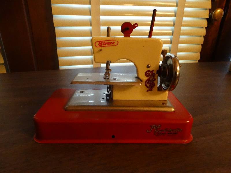 lot 130 image: Mini Vintage jet sew-o-matic sewing machine.