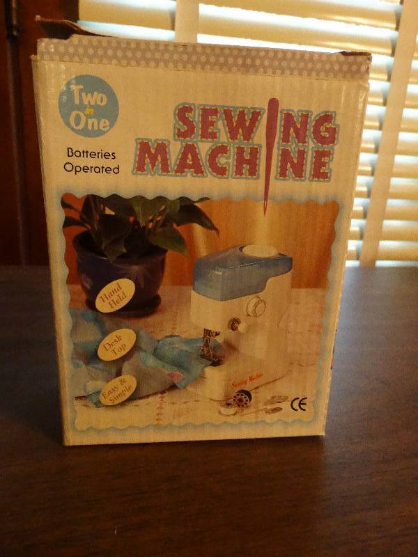 lot 135 image: Mini Vintage sewing machine.