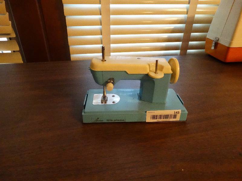 lot 143 image: Mini Vintage little princess sewing machine.