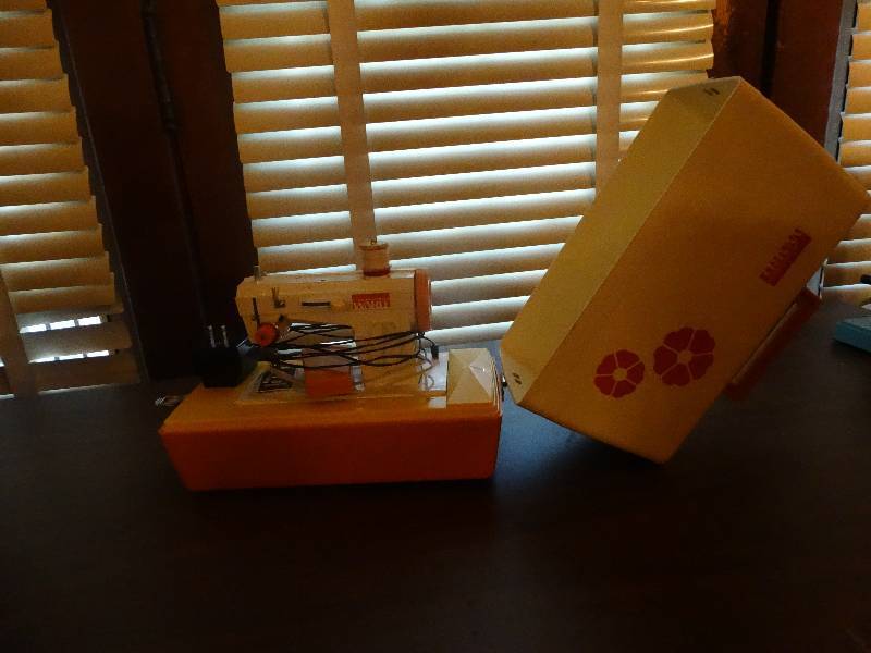 lot 144 image: Mini Vintage montgomery ward electric sewing machine.