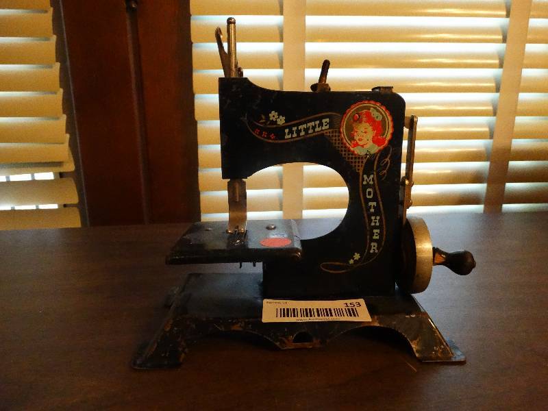 lot 153 image: Mini vintage little mother sewing machine.