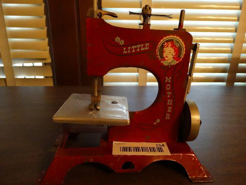 lot 154 image: Mini vintage little mother sewing machine.