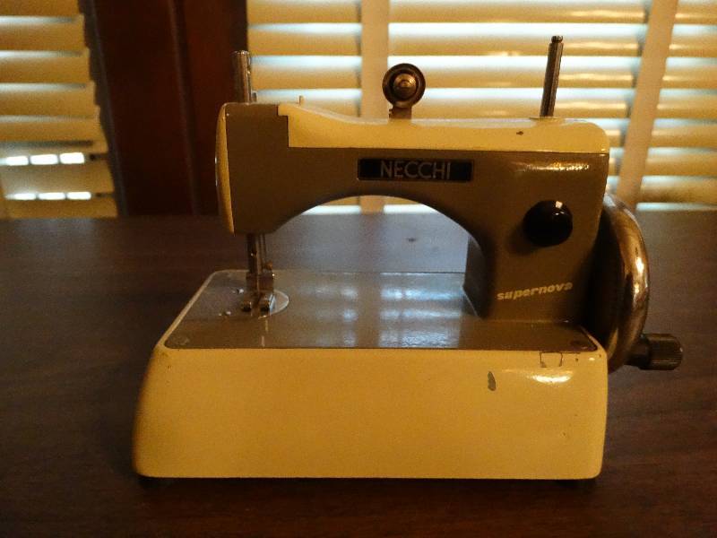lot 159 image: Mini vintage necchi sewing machine.