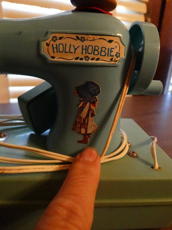lot 169 image: Mini vintage Holly hobbie sewing machine.