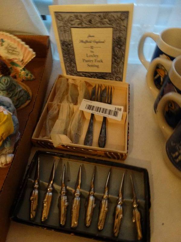 lot 198 image: Loxley pastry forks from England and Set of 8 stainless steel corn cob holders.