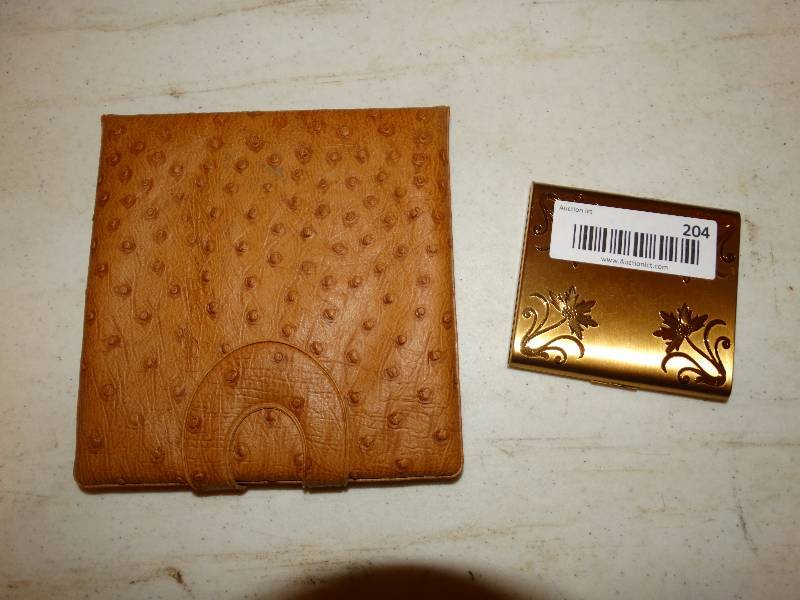 lot 204 image: Etched brass cigarette case with travel mirror.