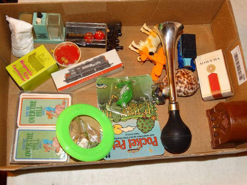 lot 205 image: Flat of toys. Cards, train, frog, horn, dice.
