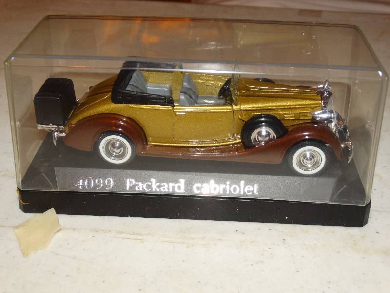 lot 224 image: 4099 Packard Cabriolet in display case.