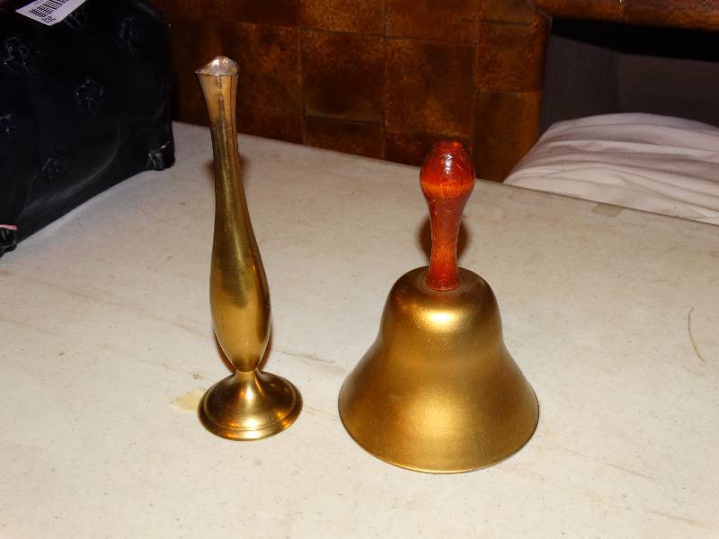 lot 244 image: Brass vase and gold bell with a wood handle.