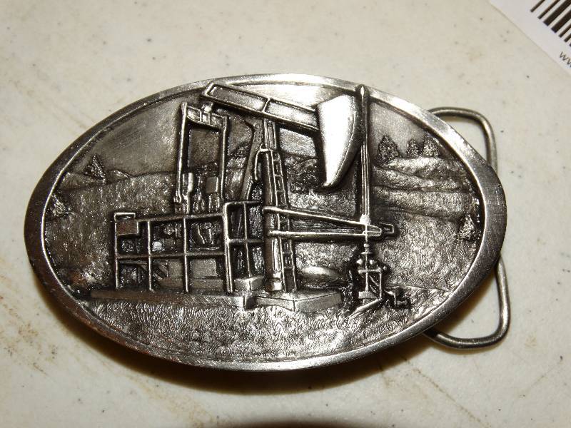 lot 247 image: Oil Pump Belt Buckle.