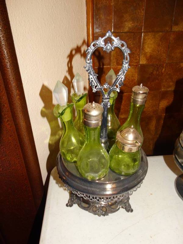lot 255 image: Antique 6- Bottle Green glass Cruet set with  silver plated caddie.