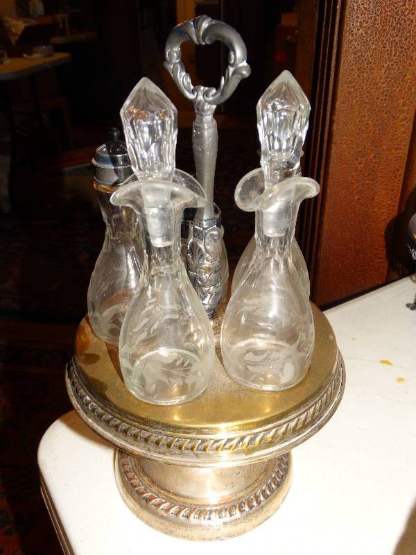lot 256 image: Antique 5- Bottle  glass Cruet set with  silver plated caddie.