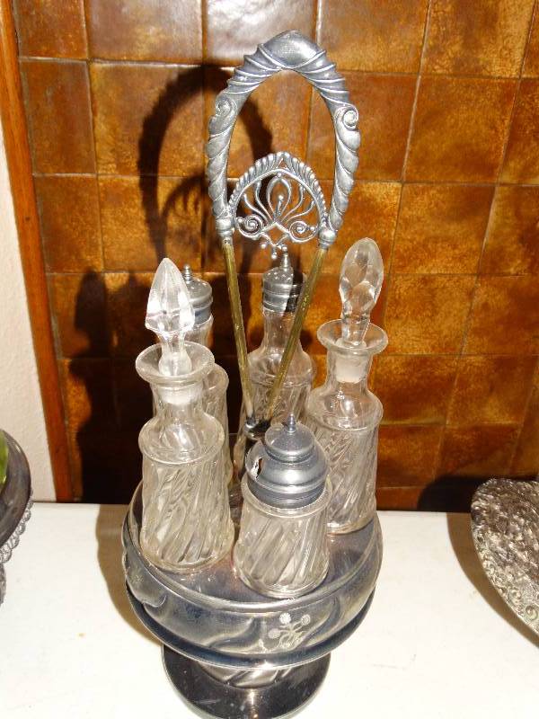 lot 257 image: Antique 5- Bottle  glass Cruet set with  silver plated caddie.