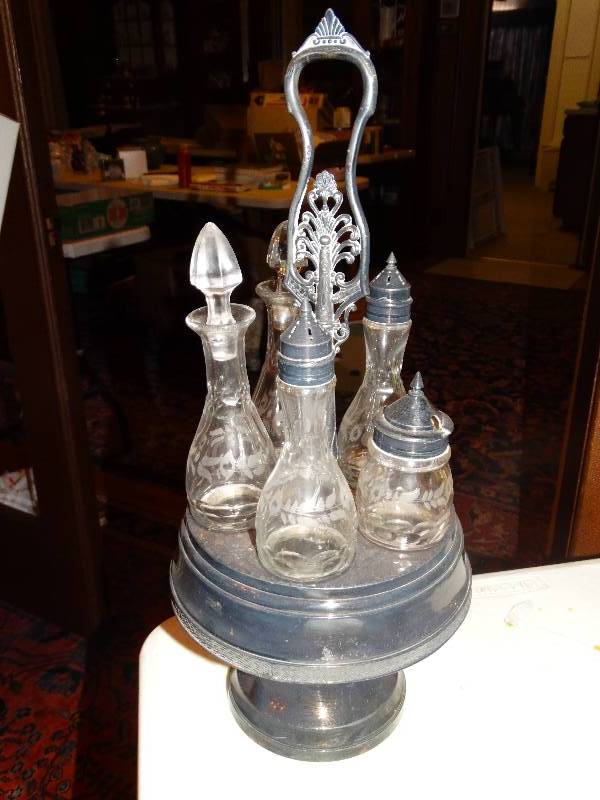 lot 258 image: Antique 5- Bottle  glass Cruet set with  silver plated caddie.