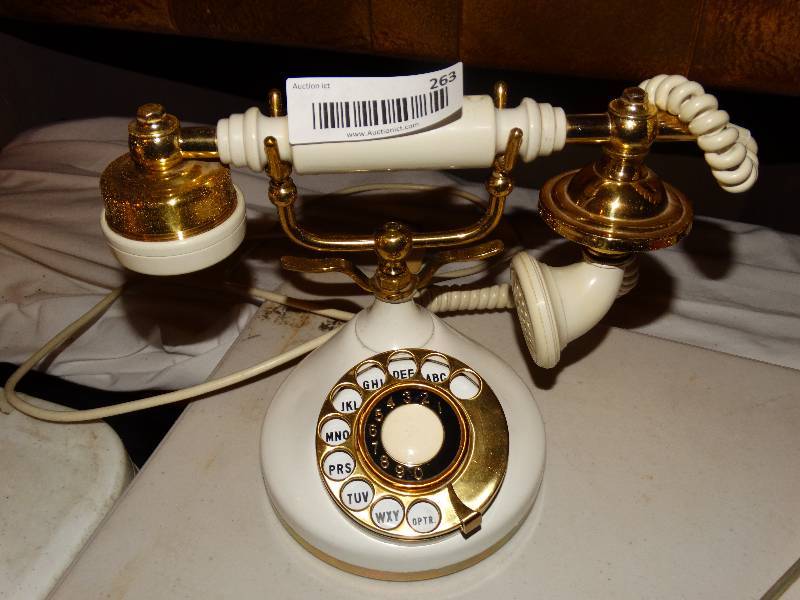 lot 263 image: Vintage white rotary phone.