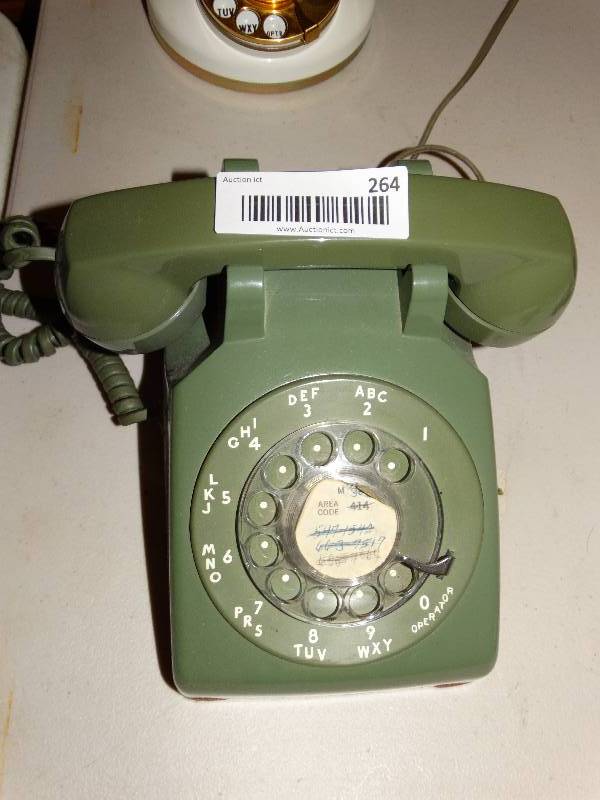 lot 264 image: Vintage green rotary phone.