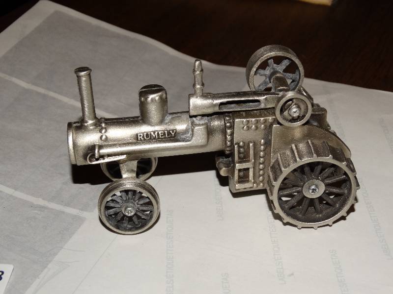 lot 268 image: Pewter Rumely Tractor.