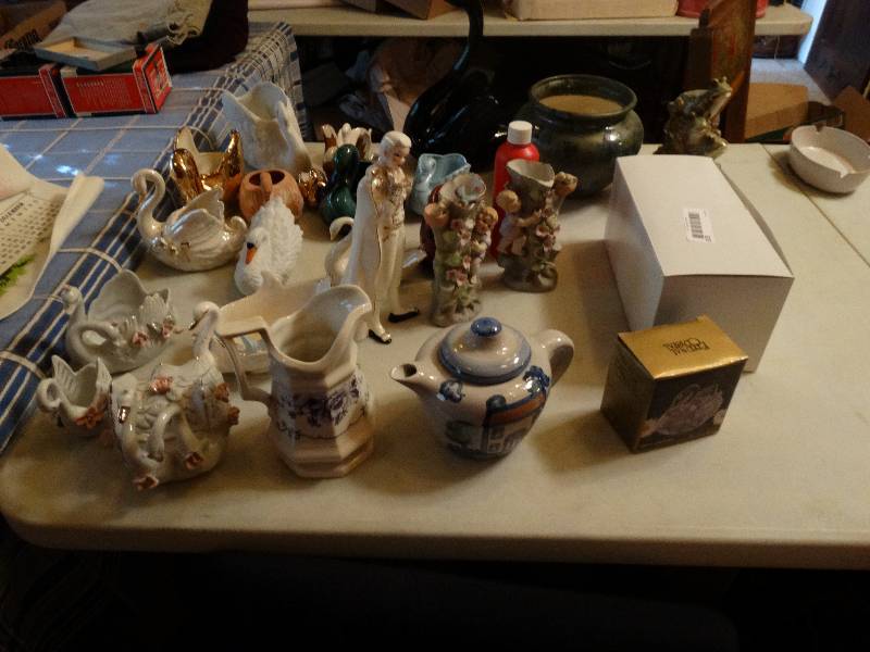 lot 320 image: Home decor assorted swans, frog, planter, ect.