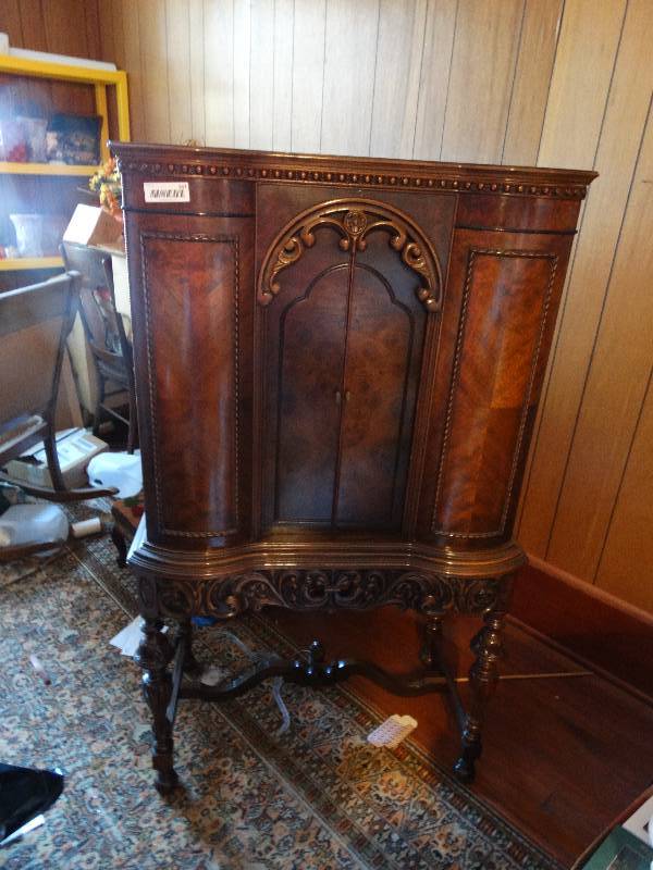 lot 347 image: Antique Burl Wood Heavy Carved Walnut Radio console made by saginaw furniture shop.