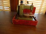 Mini vintage betsy ross sewing machine.