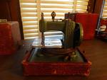 Mini vintage betsy ross sewing machine.
