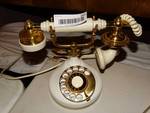 Vintage white rotary phone.