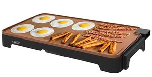lot 40010 image: BELLA XL Electric Ceramic Titanium Griddle, Make 15 Eggs At Once, Healthy-Eco Non-stick Coating, Hassle-Free Clean Up, Large Submersible Cooking Surface, 12in x 22in, CopperBlack