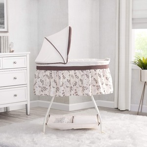 lot 40182 image: Delta Children Deluxe Sweet Beginnings Bedside Bassinet - Portable Crib with Lights and Sounds, Falling Leaves