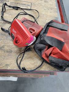 lot 43093 image: 2 Milwaukee M12 Battery Chargers And Bag