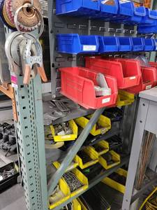 lot 43058 image: Contents Of Shelf and Bin Organizer W Grinding Discs, Clamps Fittings, and More