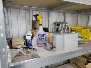 lot 43030 image: Contents Of Shelf W Couplers Trailer Brakes, and More