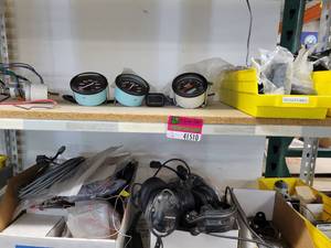 lot 41510 image: Contents Of 2 Shelves, Including Speedometers And More
