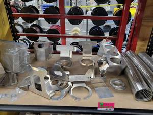 lot 41511 image: Contents Of Shelf Including Assorted Aluminum Fabricated Pieces