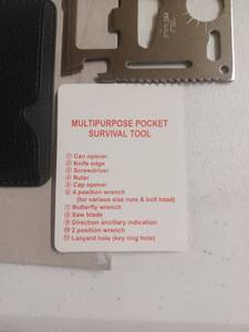 lot 122 image: New multi purpose pocket survival tool with case. Great graduation gift
