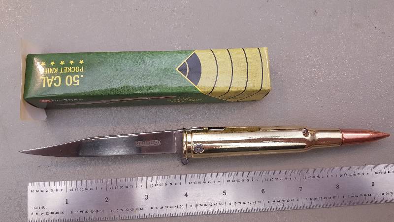 lot 444 image: Spring Assist 50 Caliber Bullet Knife