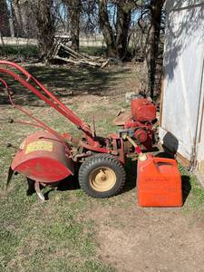 lot 1006 image: Troy Bilt roto tiller with 5 gallon gas can