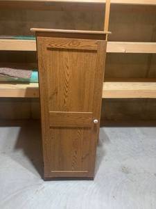 lot 2052 image: Storage cabinet. 52 x 21.5 x 13. Located in the basement