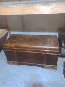 lot 2054 image: Cedar chest. Top needs repair. Approximately 24 x 45 x 19. Located in the basement