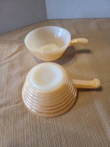 lot 2106 image: Two vintage Fire King peach luster ovenware