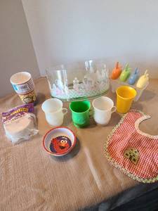 lot 2119 image: Plastic bowl, popsicle makers, plastic Kool-aid cups, streamer, baby bib, more.