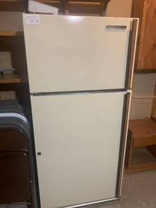 lot 2060 image: GE refrigerator. 66.5 x 30.5 x 31. Located in the basement