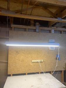 lot 2062 image: 48 inch shop light. Located in the basement