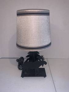 lot 2206 image: Table top lamp. Approximately 14 inches tall. Has tree and moose cut out