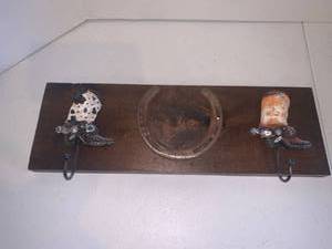 lot 2211 image: Coat or hat rack. With horseshoe and cowboy boot hooks. 6 x 17