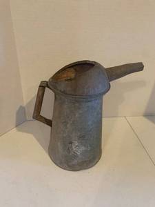lot 2224 image: Metal pitcher. Approximately 12 inches tall